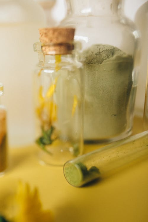Free Herbal Powder on a Glass Container Stock Photo