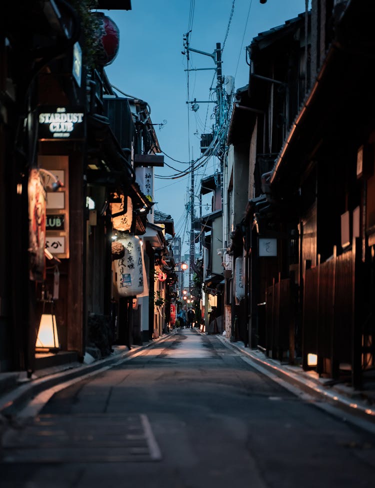 Empty Alley In Between Restaurants And Shops