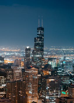 A captivating view of Chicago's illuminated skyline featuring the iconic Willis Tower.