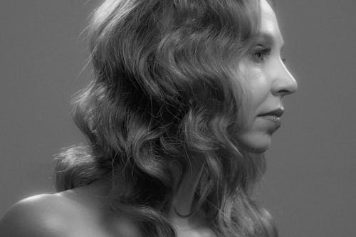 Grayscale Photo of a Pretty Woman with Wavy Hair