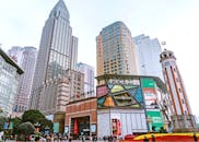 The City Skyline of Central Chongqing, China with the People's Liberation Monument on the Side