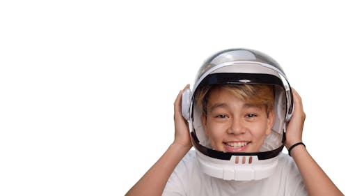 Boy Wearing a Helmet on Plain White Background