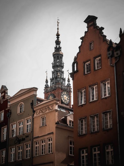 Free Charming view of historic buildings and town hall tower in Gdańsk, showcasing unique architecture. Stock Photo