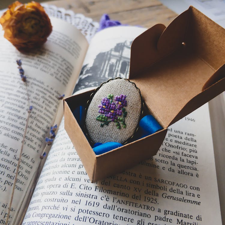 Brooch With Embroidered Flower On Book