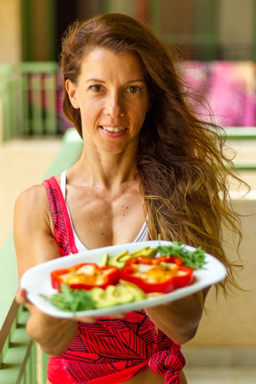 Portrait of a Woman Holding a Plate with Healthy Food