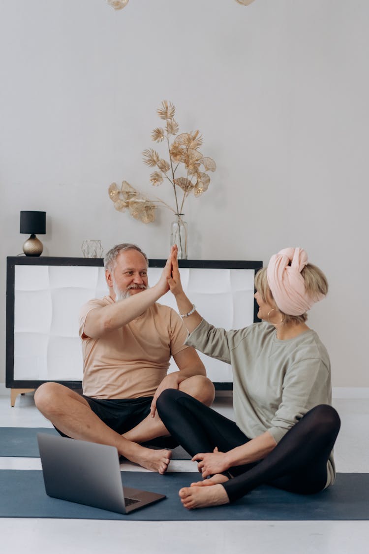 Elderly Couple Doing High Five