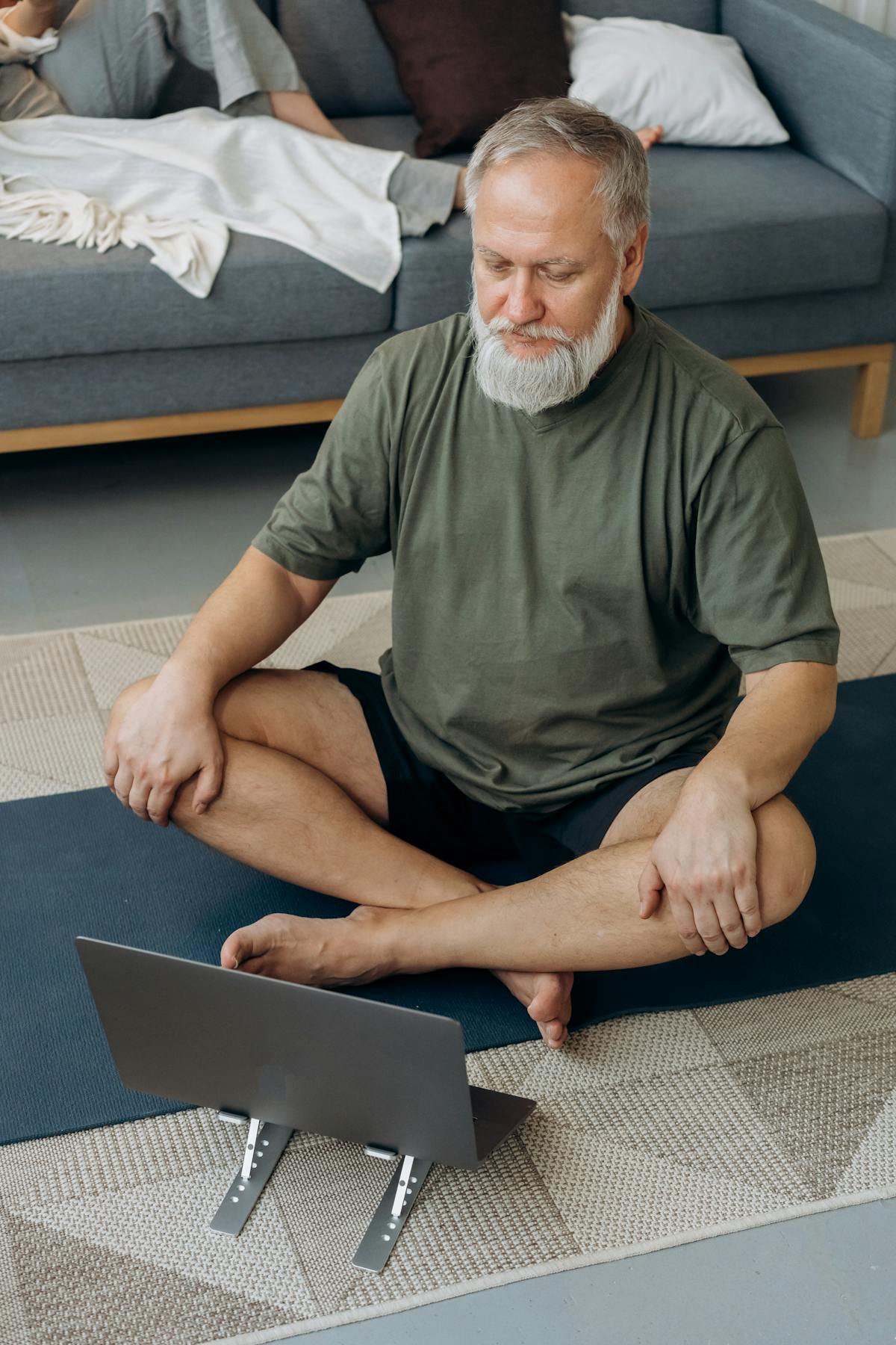 Man practicing deep breathing meditation exercise