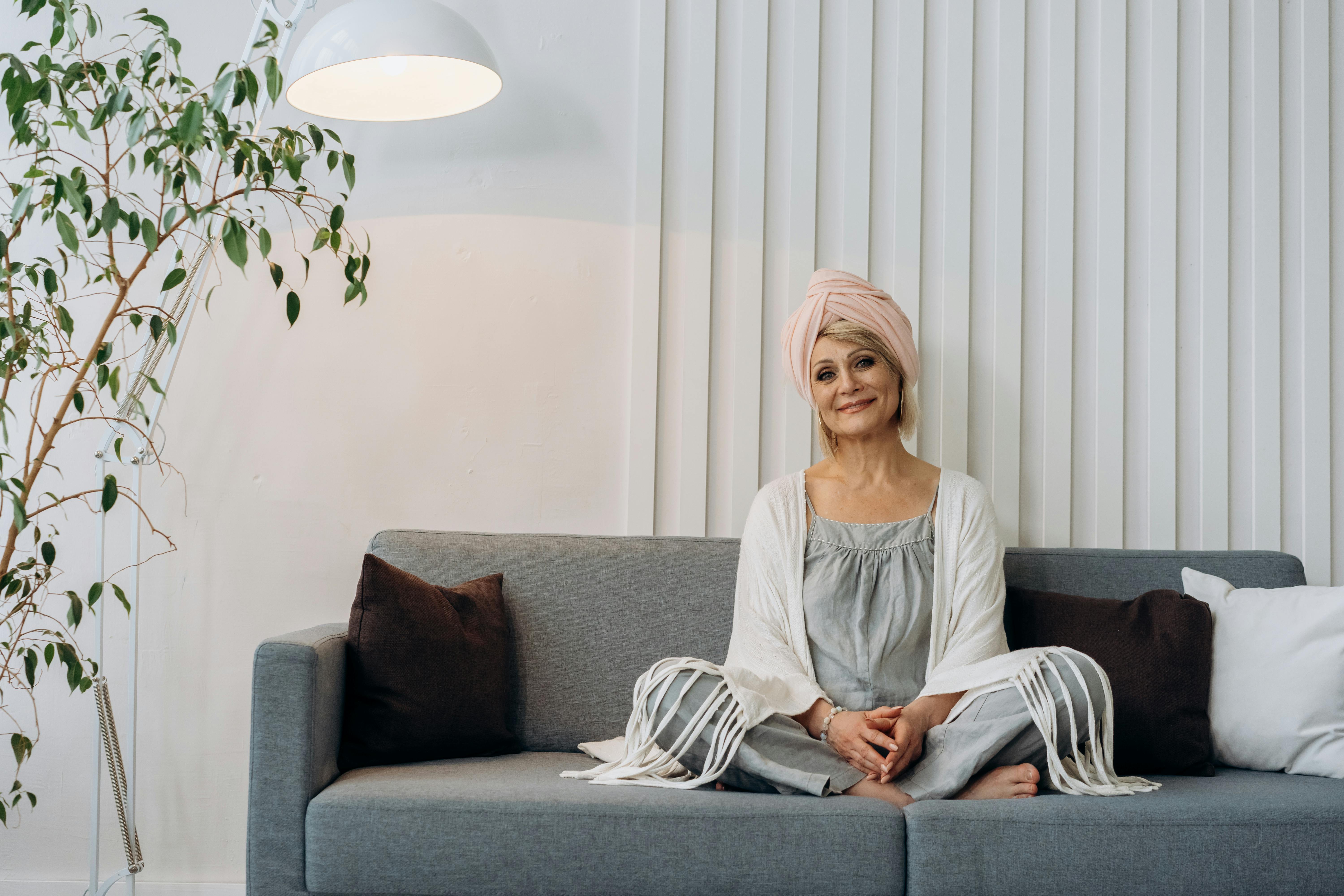 an elderly woman sitting on the sofa