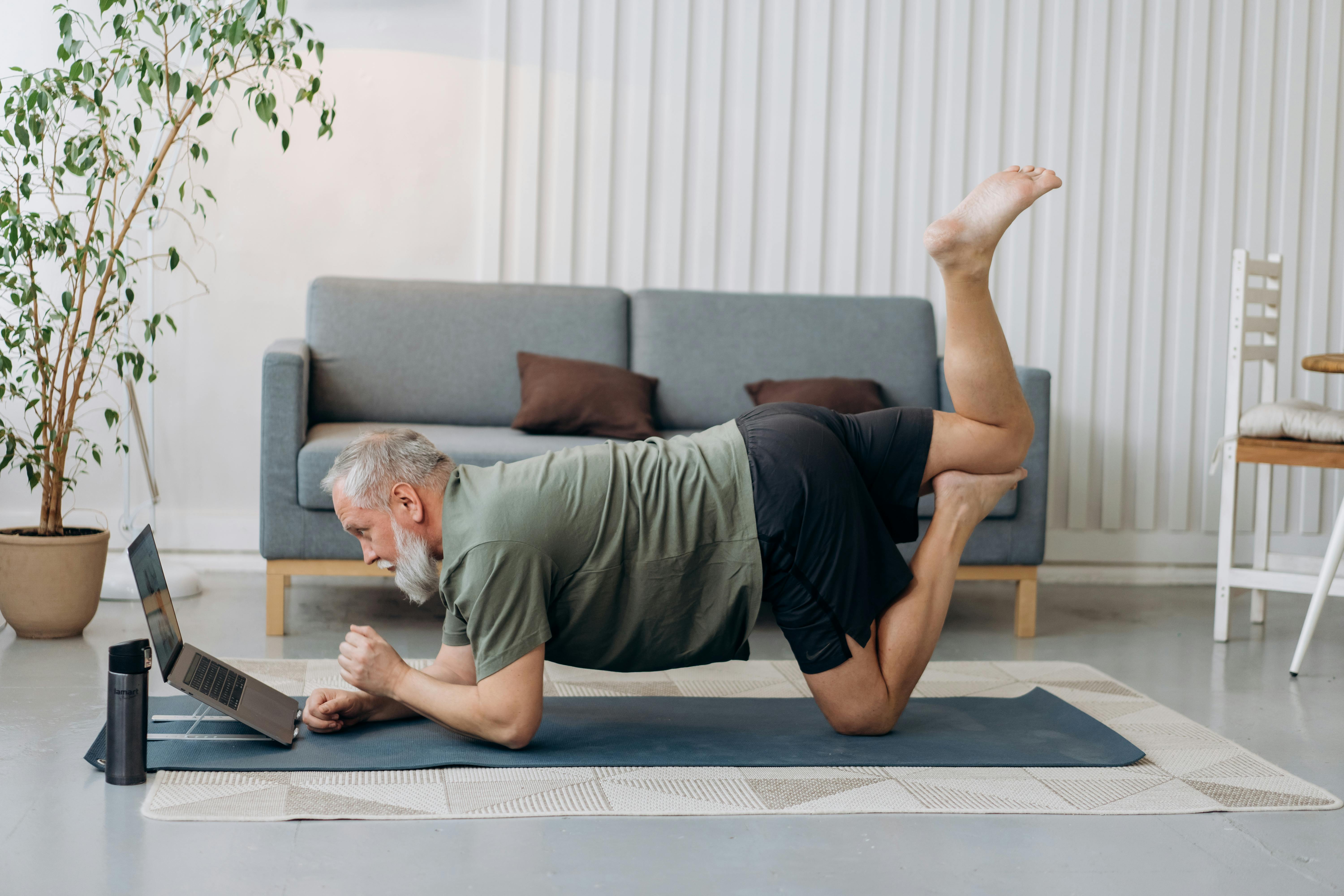 man posing on a yoga mat