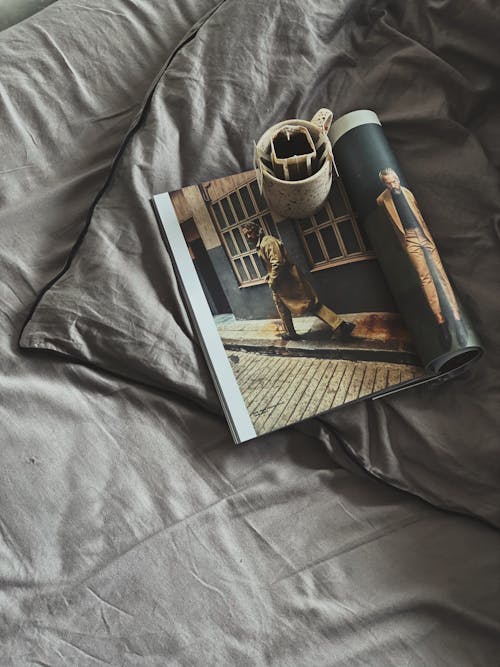 Coffee cup with filter placed on crumpled bed