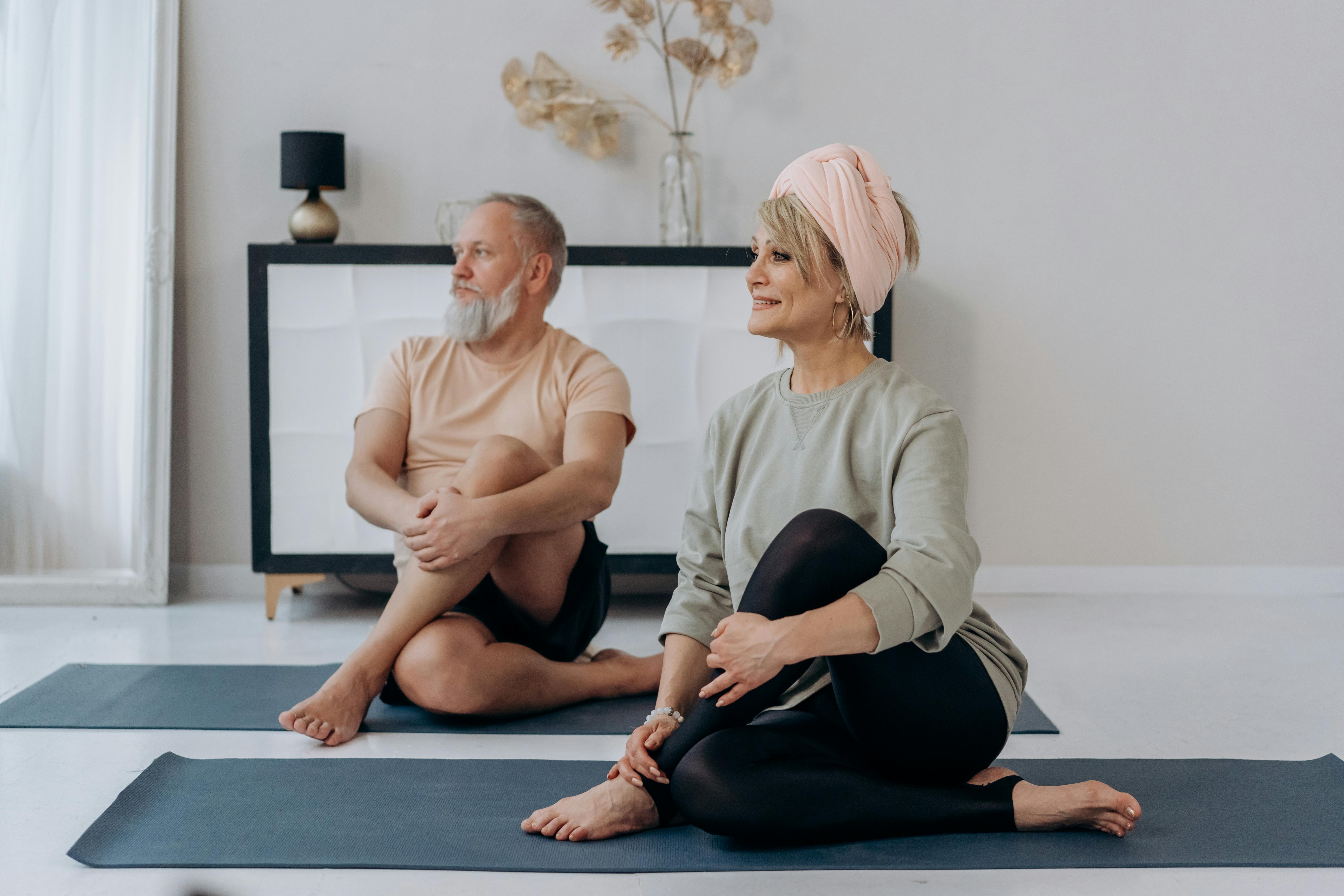 an elderly couple exercising together