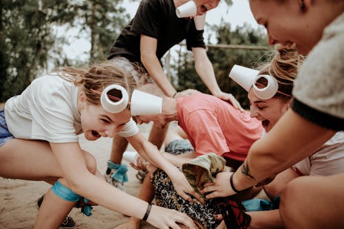 Boys and Girls Playing with Cups