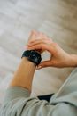 Person Looking at Her Black Smartwatch