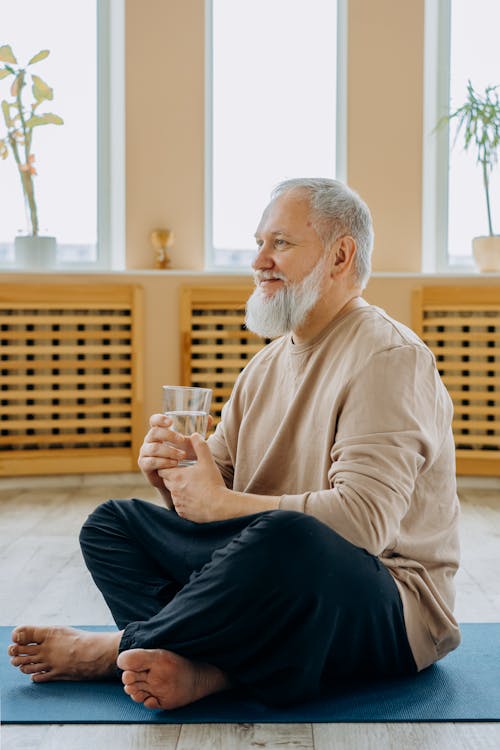 Free Photo of an Elderly Man Holding a Glass of Water Stock Photo