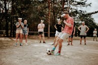 A Group of People Wearing Improvised Eyeglasses Made of Disposable Cups While Playing Football
