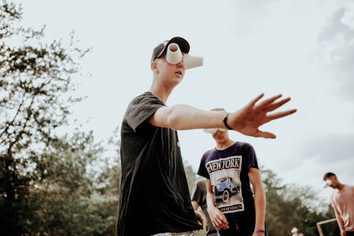 A Group of Men Wearing Improvised Eyeglasses While Playing