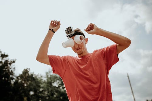 Man with Disposable Cups on His Face