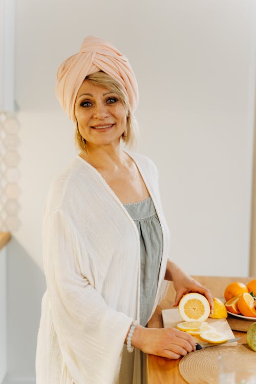 A Woman Slicing a Lemon