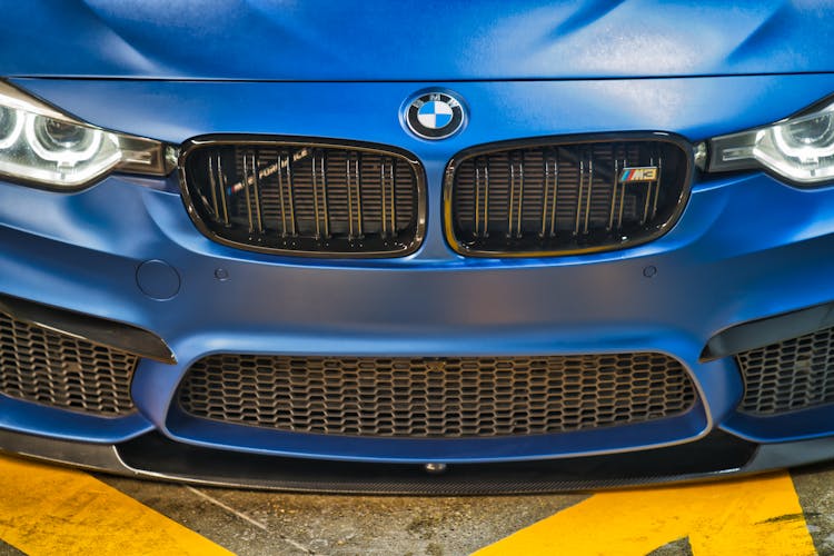 A Front Of A Blue BMW Car