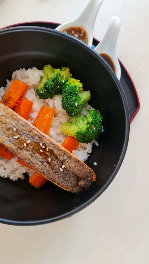 Free Rice Topped with Cooked Meat and Vegetables Stock Photo