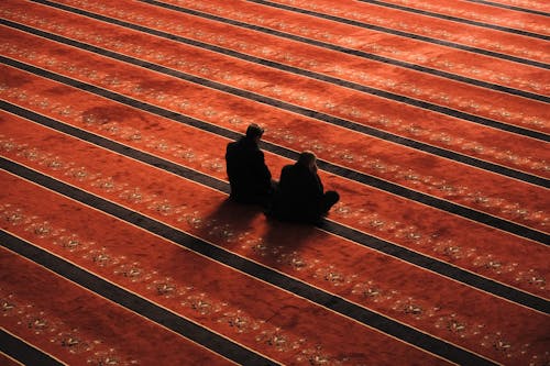 Free People Praying inside a Mosque Stock Photo
