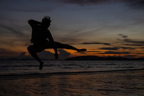 Silhouette of a Person Doing a Jump Shot