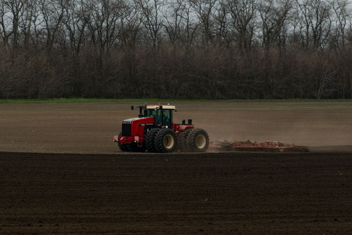 Red tractor opening spring ground