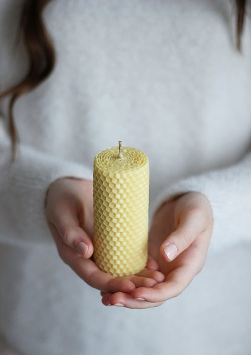 A Person Holding a Candle