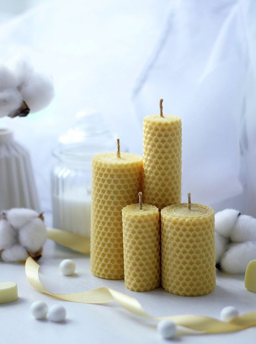 Free A serene arrangement of beeswax candles and cotton with a soft, calming ambiance. Stock Photo