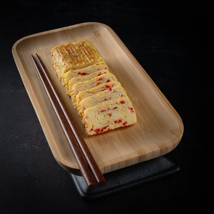 A Tamagoyaki Dish On A Wooden Tray