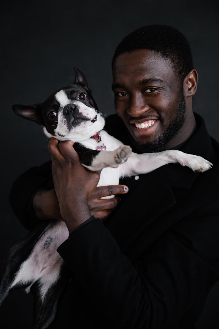 Black Man Hugging Cute Dog