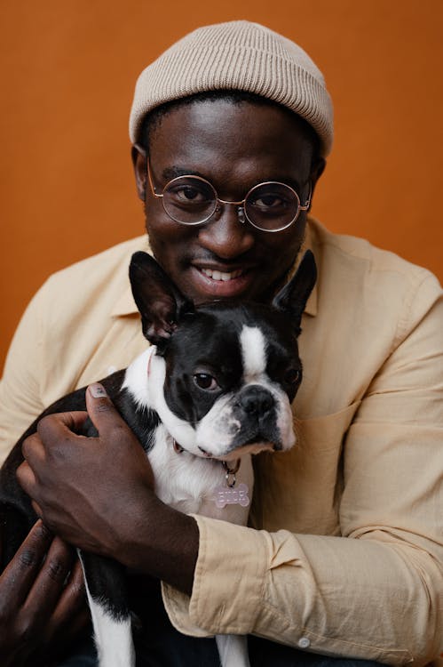 Free Black male in glasses with dog Stock Photo