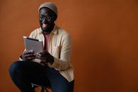 Black man looking at tablet