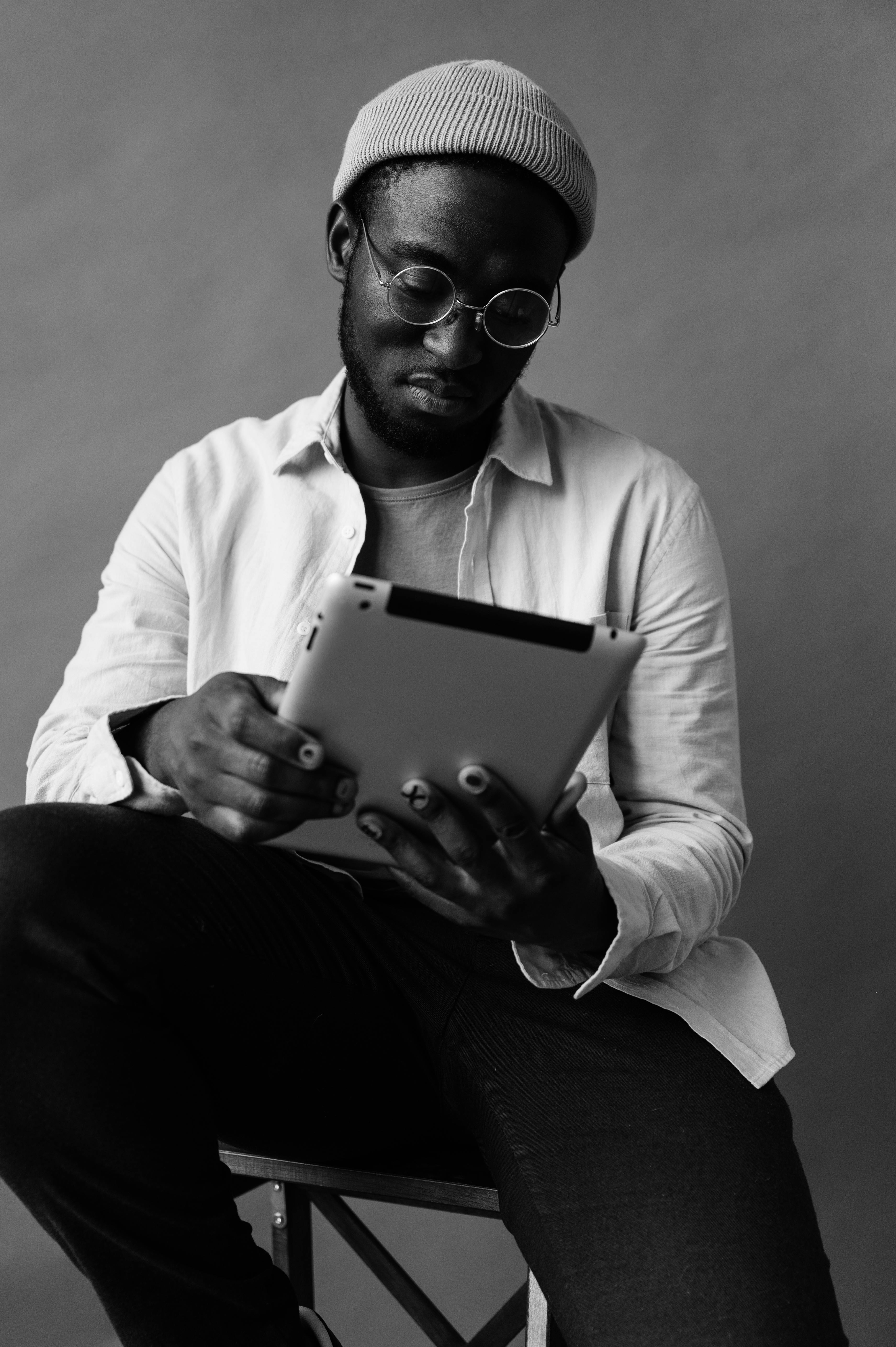 focused black man with tablet