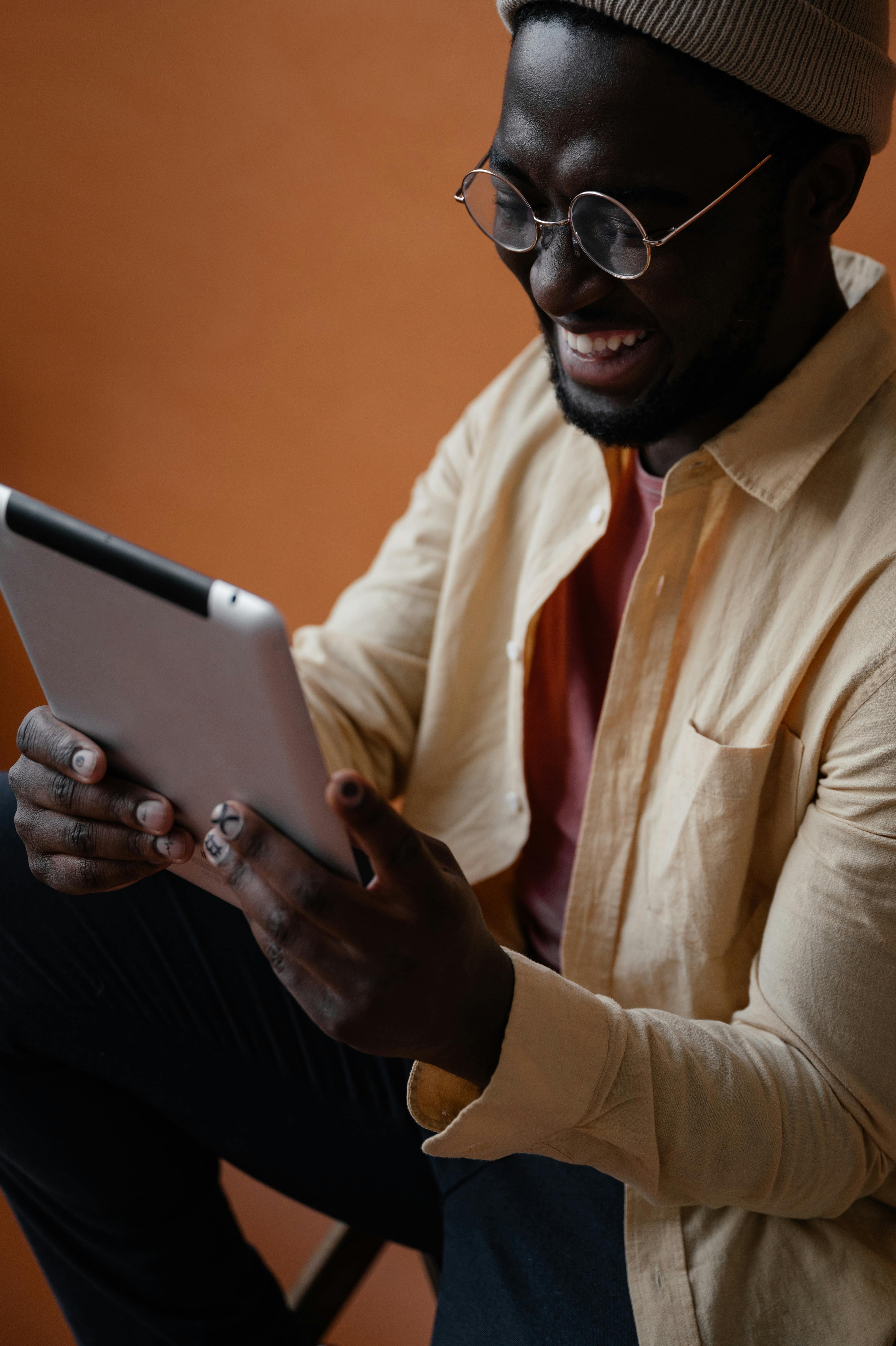 happy black man with tablet