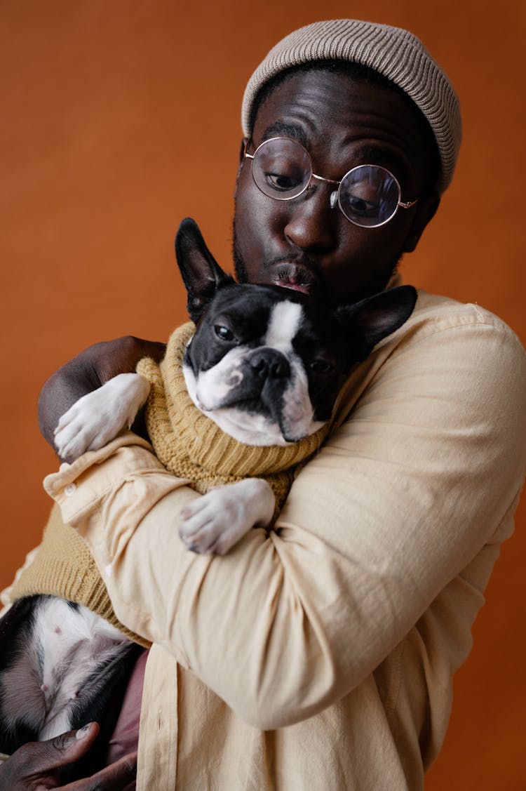 Cute Black Man Kissing Dog On Head