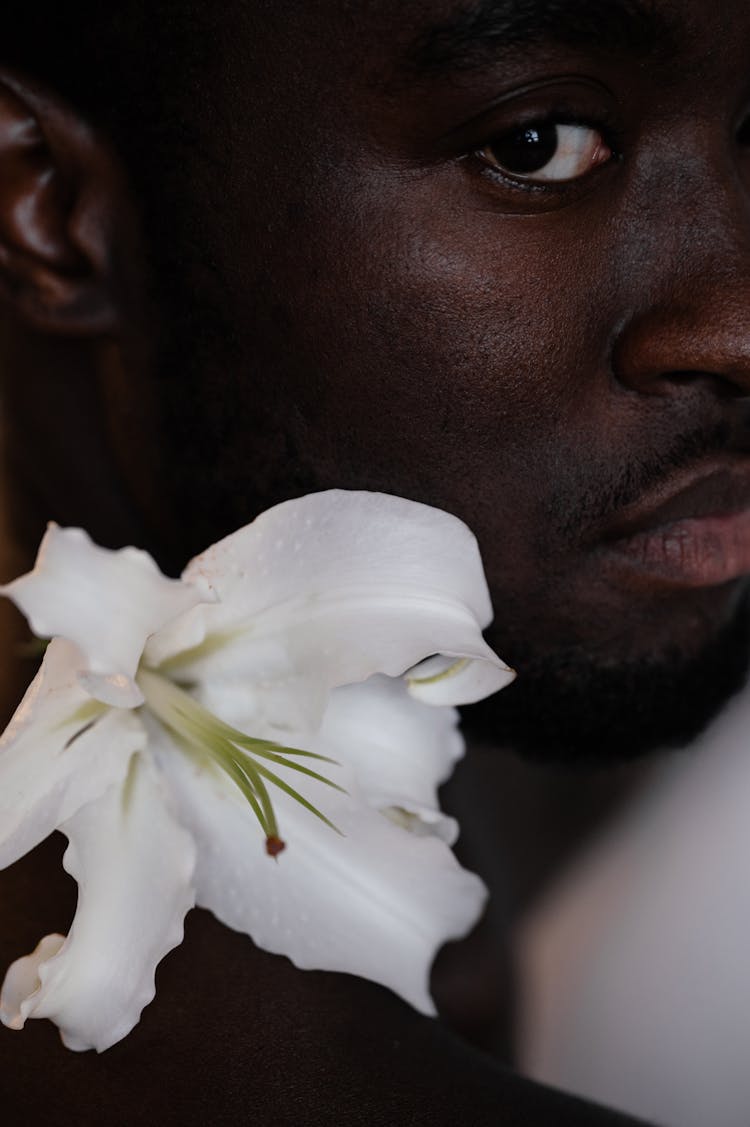 Peaceful Black Man With Lily Flower