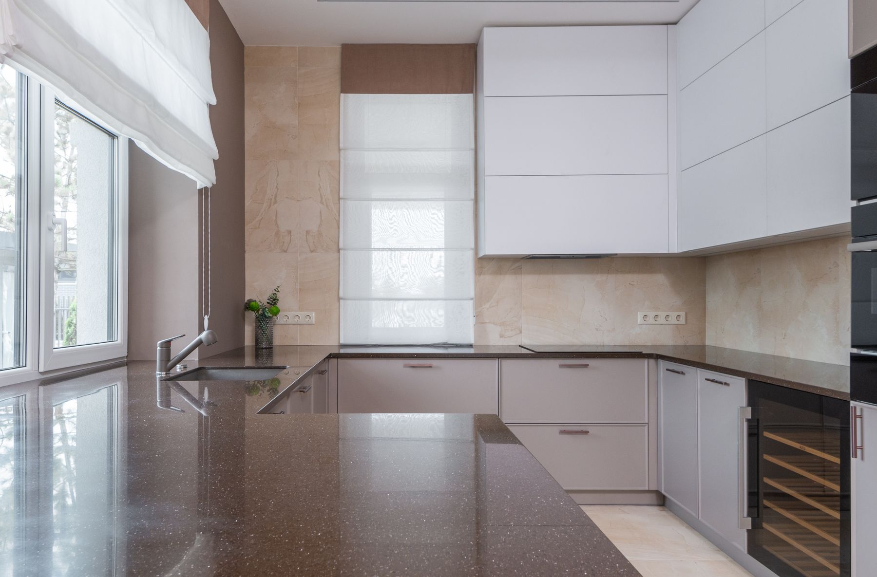 Light minimalist kitchen with stone worktop