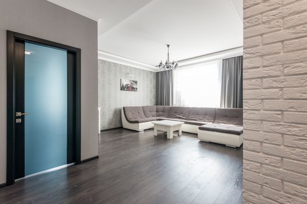 Modern living room with dark wood-look flooring