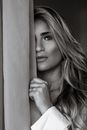 Grayscale Photo of Woman Holding Her Chin