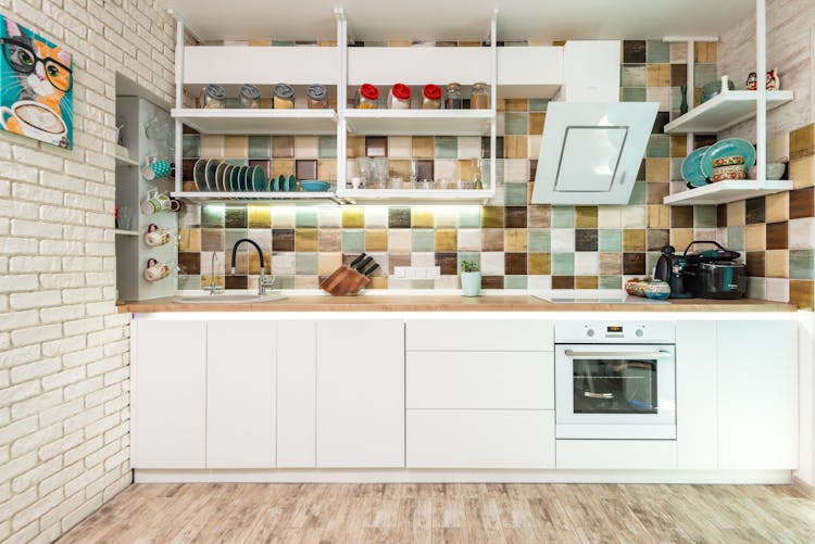 Cozy Light Kitchen With White Furniture And Appliances