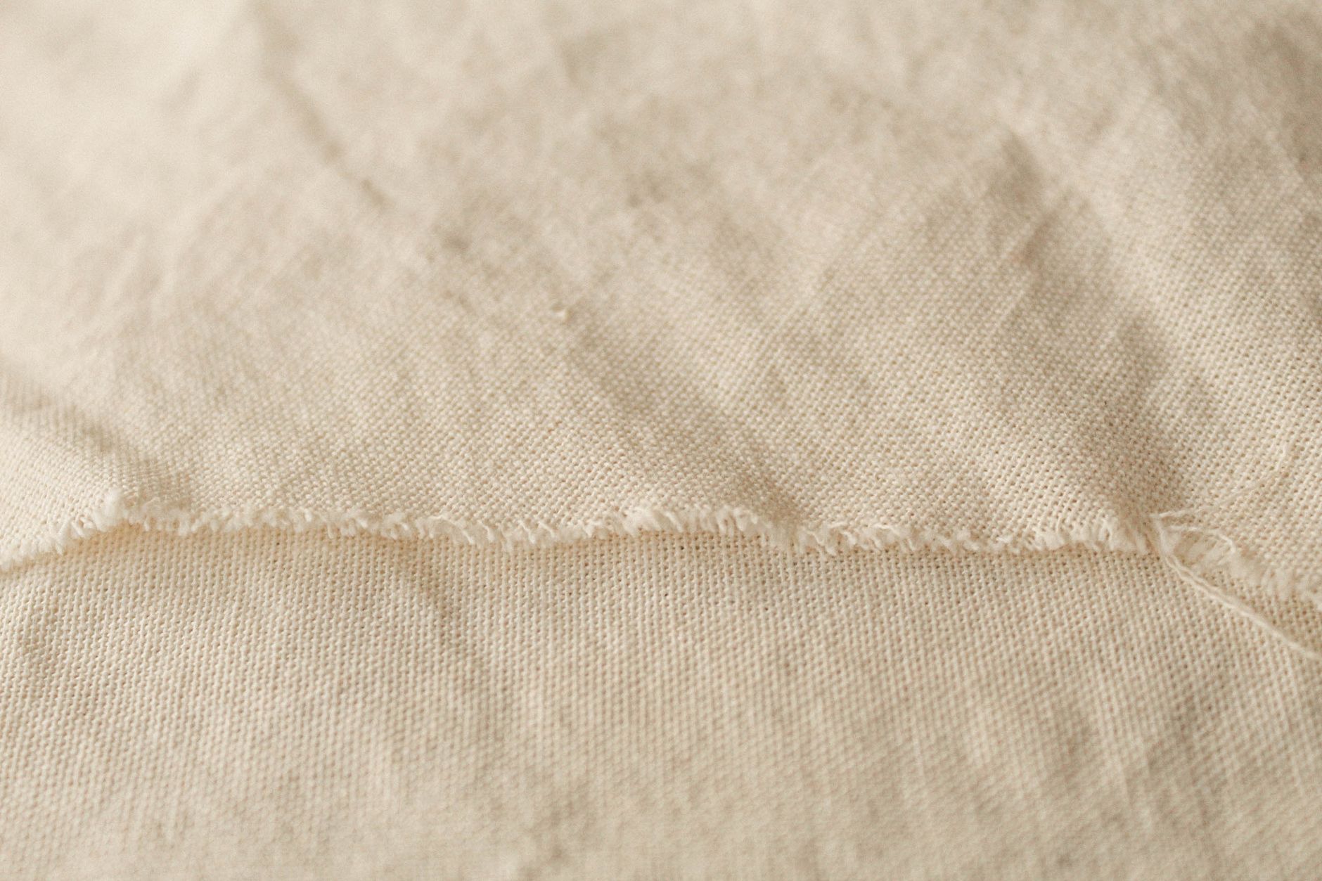 Close-up comparison of plain weave linen and twill weave linen fabric structures