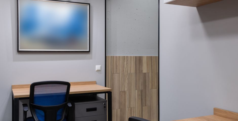 A contemporary empty office space — treatment is scheduled after hours so work is never disrupted