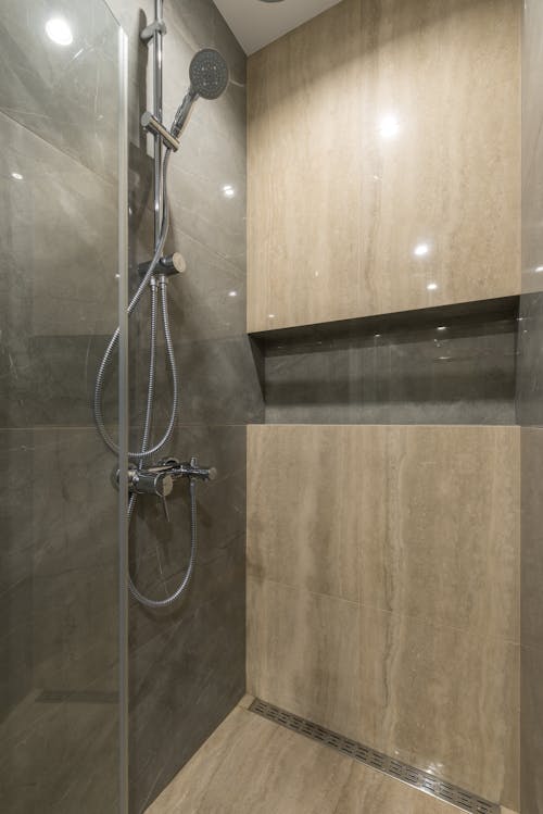 Free Interior of minimalist bathroom with shower cabin Stock Photo