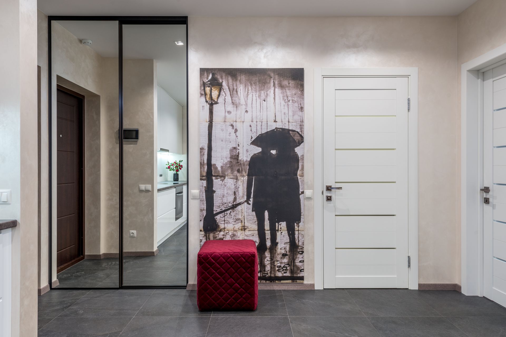 Corridor interior with closet with mirrored doors and pouf