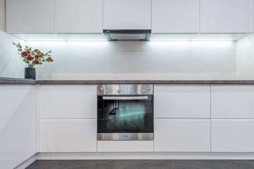 Minimalist furniture of modern kitchen with built in appliances