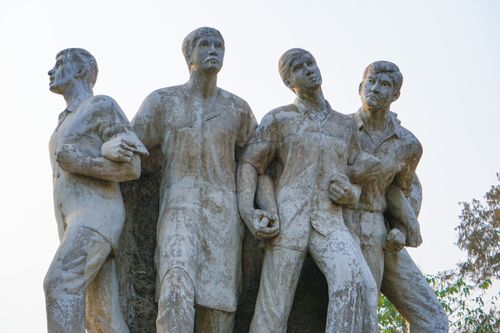 Free Close-up of a historic protest monument with four figures in Dhaka, Bangladesh. Stock Photo