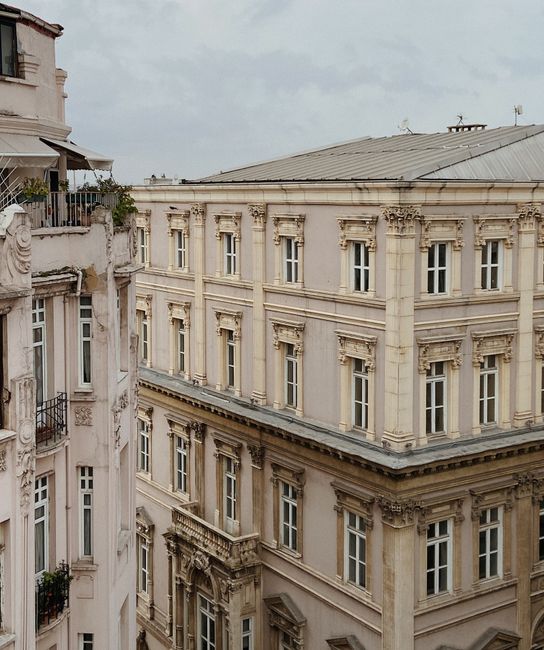 Aerial view of historic European architectural building with ornate facade in the city.