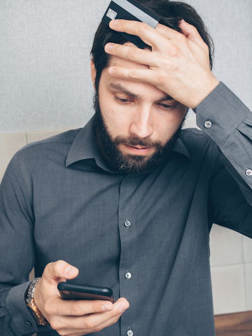 Free Man in Black Button Up Shirt Holding Smartphone Stock Photo