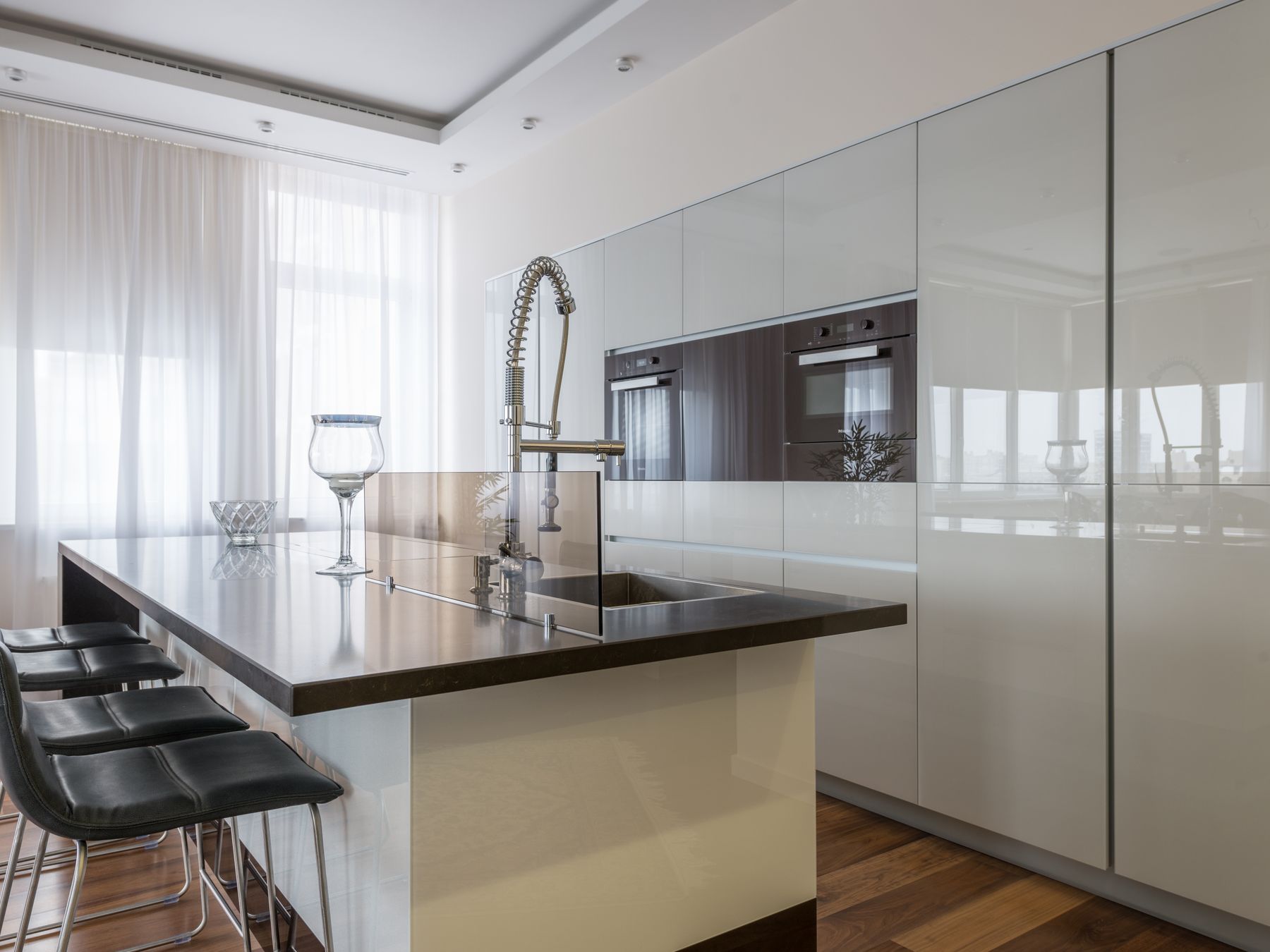 Kitchen Spraying in Swiss Cottage — careful masking before painting begins